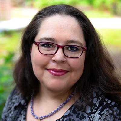 Professional headshot of Alisha Olin