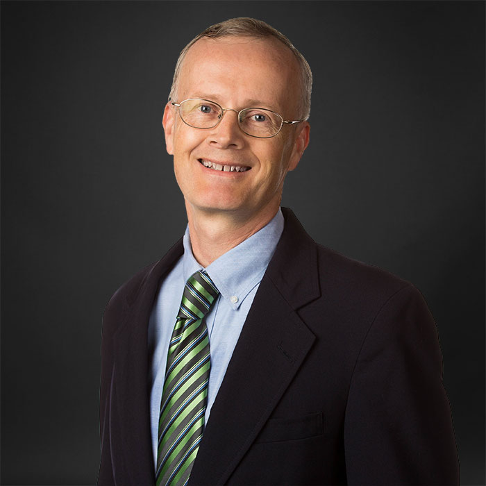 portrait of professional man on a dark background